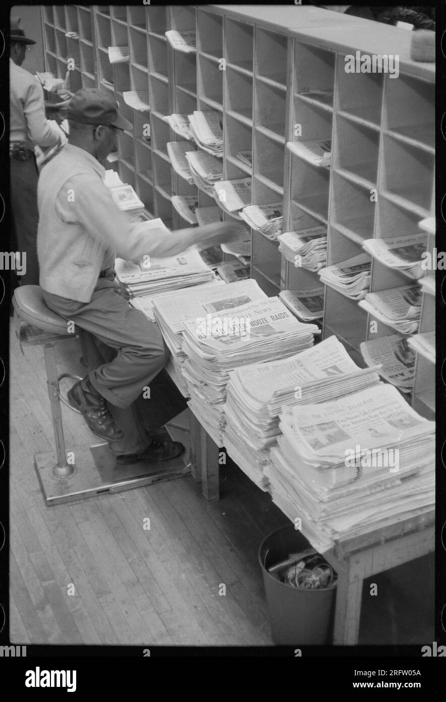 Workers sorting mail at the United States Post Office in New York City, NY in 1957. Stock Photo
