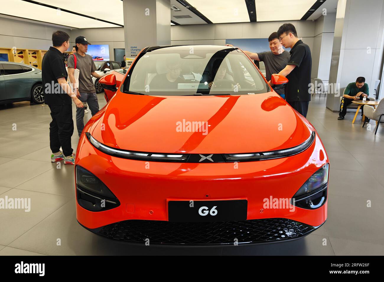 SHANGHAI, CHINA - AUGUST 5, 2023 - Customers experience the new Xiaopeng G6 model at the Xiaopeng Automotive Experience Store in Shanghai, China, Augu Stock Photo