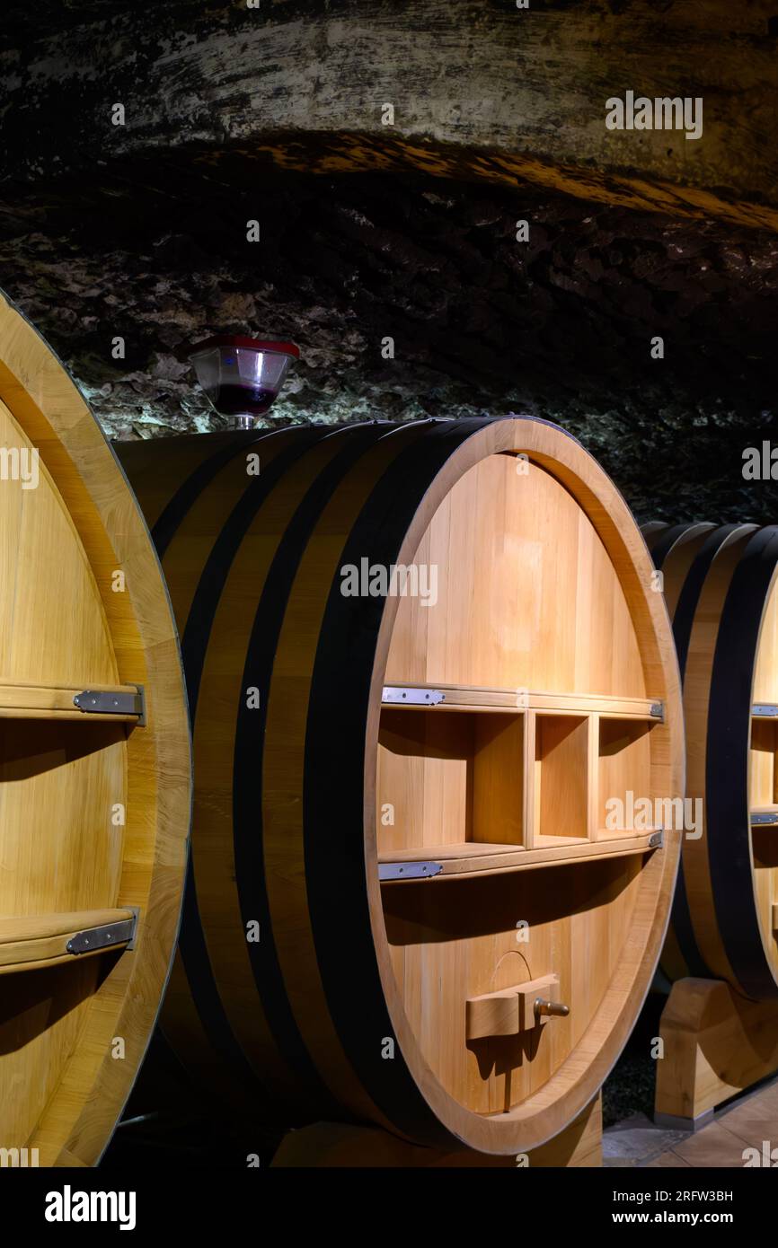 Underground wine cellars with barrels for aging of red dry wine in