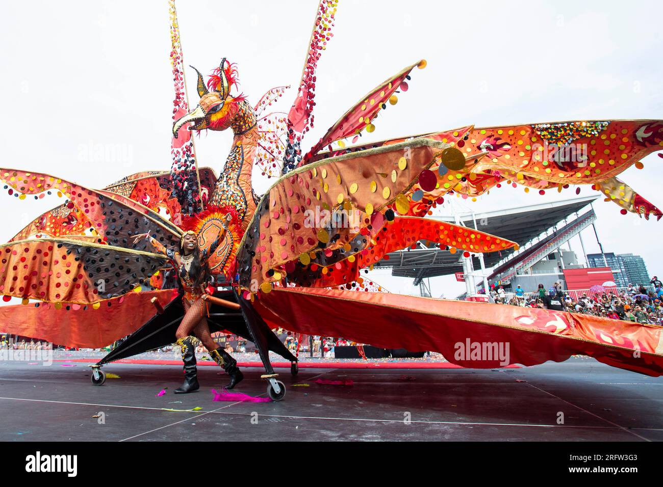 Toronto, Canada. 5th Aug, 2023. A dressedup reveler performs with her