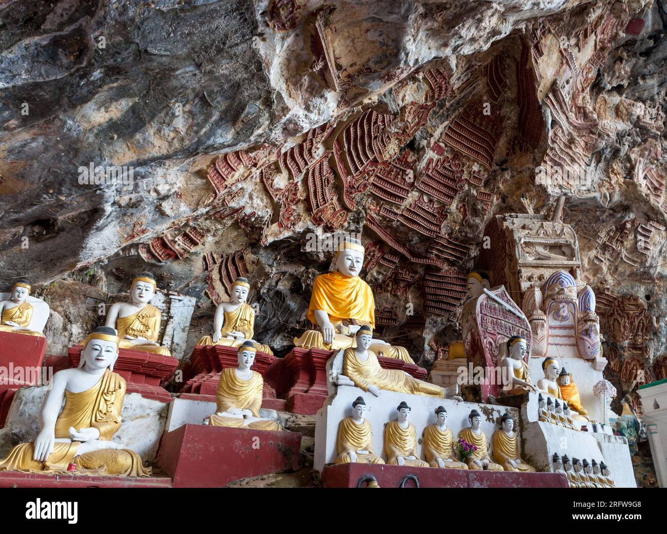 Old temple with buddha statues in Kaw Goon cave. Myanmar. Stock Photo