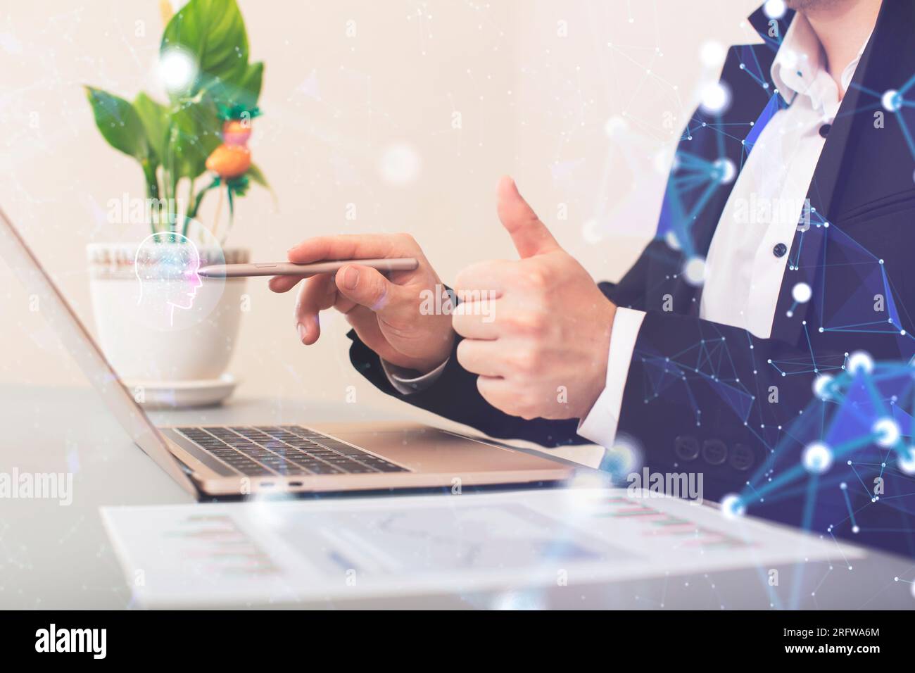 Businessman using a laptop computer chatting Stock Photo