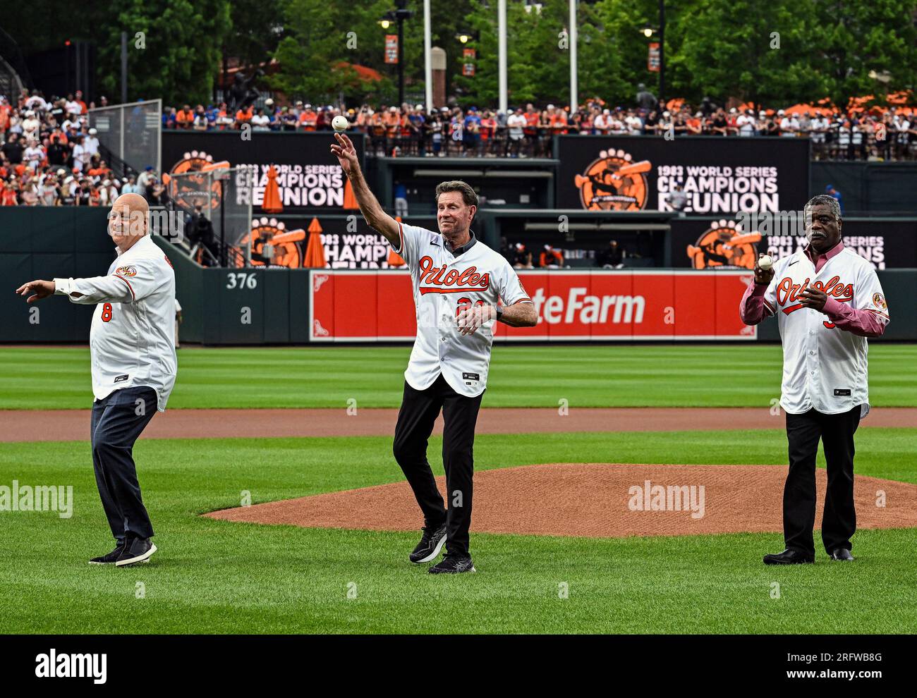 BALTIMORE, MD - August 5: Former Baltimore Orioles players (L-R), Cal  Ripken Jr, Jim Palmer and Eddie Murray throw out the ceremonial first pitch  prior to the New York Mets versus the