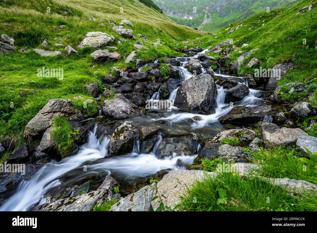 Summer landscape of the Fagaras Mountains, Romania. A view from the hiking trail near the Balea Lake and the Transfagarasan Road. Stock Photo