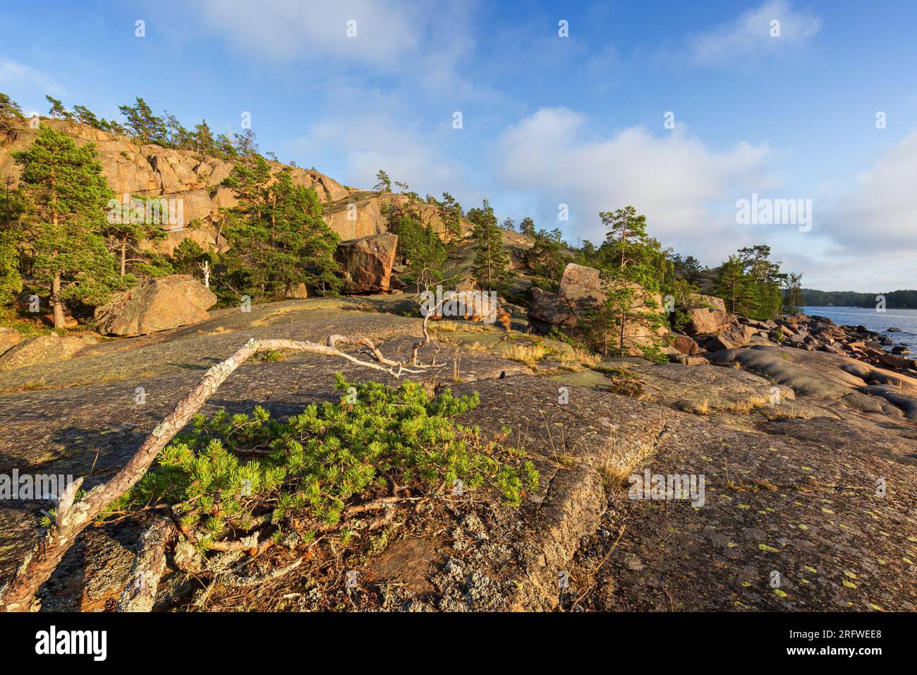 Scenic landscape of rugged rocks&cliffs by the sea at Geta in Åland Islands, Finland, on a sunny day in the summer. Off the beaten path in the nature. Stock Photo