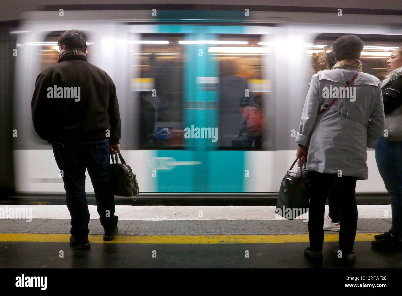 Paris, France - March 27 2018: Commuters during the morning rush hours on the line 9 of the Paris Metro. Stock Photo