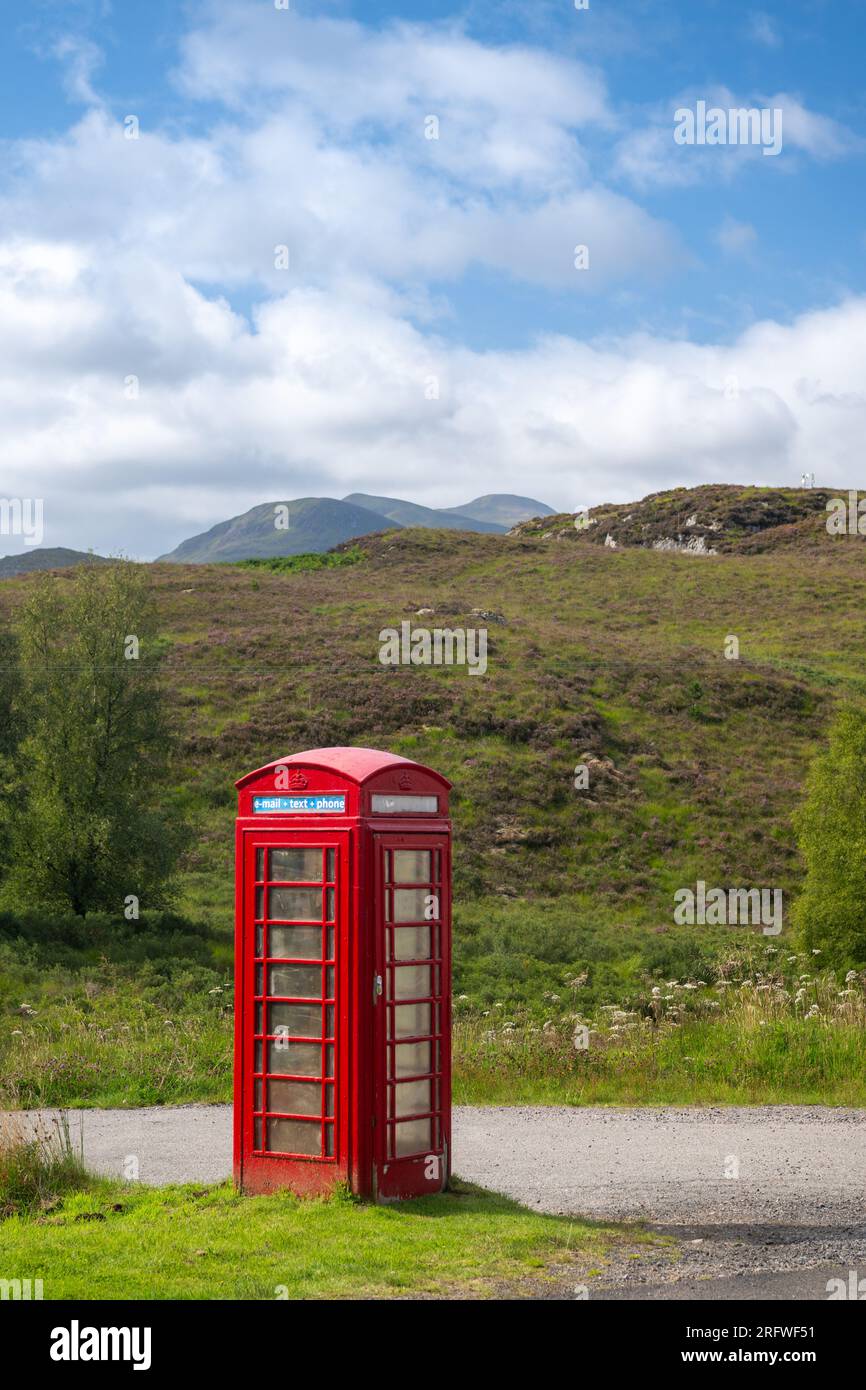 Iconic Red Telephone Box in and isolated area of the Scottish Highlands, UK Stock Photo