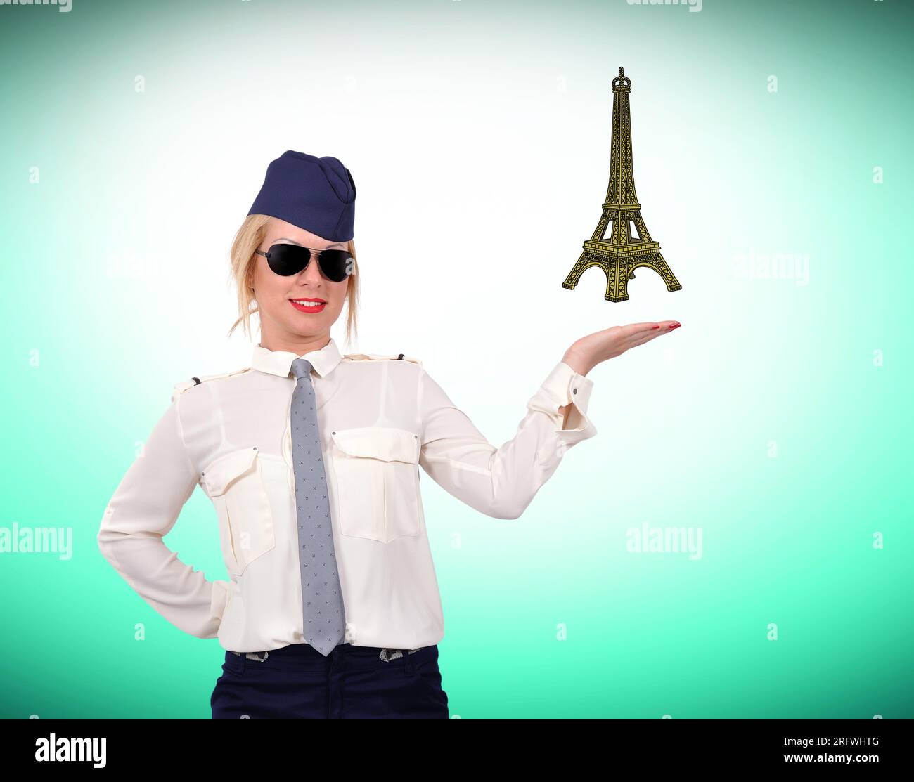 stewardess holding eiffel tower on green background Stock Photo Alamy