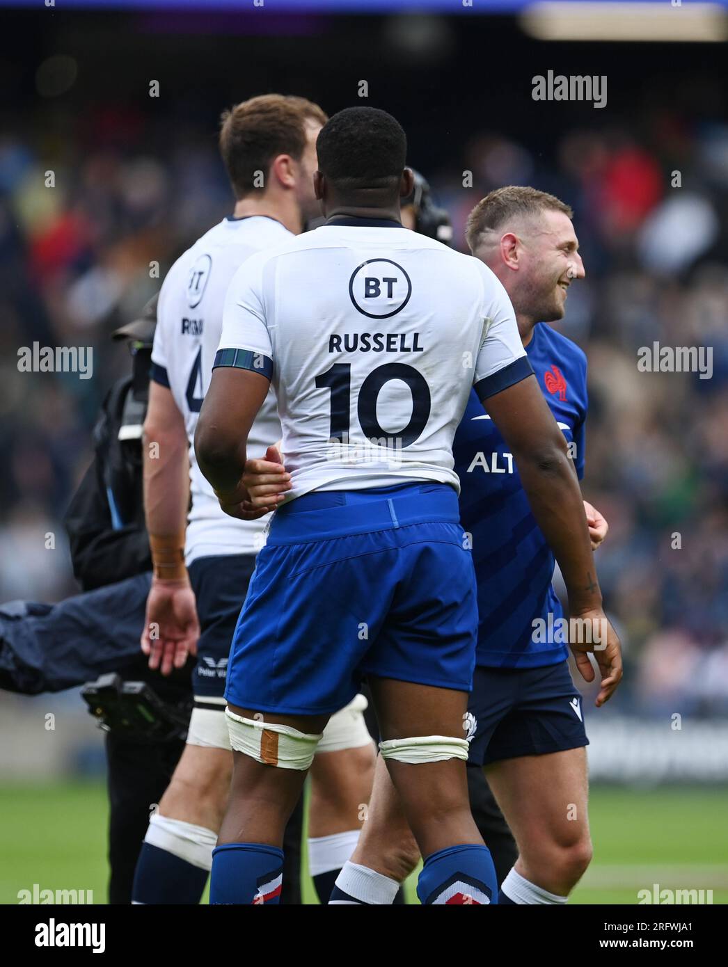 Scottish Gas Murrayfield.Edinburgh.Scotland, UK. 5th Aug, 2023. Scotland v France. The Famous Grouse Nations Series 2023. Scotlands Captain Finn Russell swaps shirts with his former club Racing 92 team mate Cameron Woki Credit: eric mccowat/Alamy Live News Stock Photo