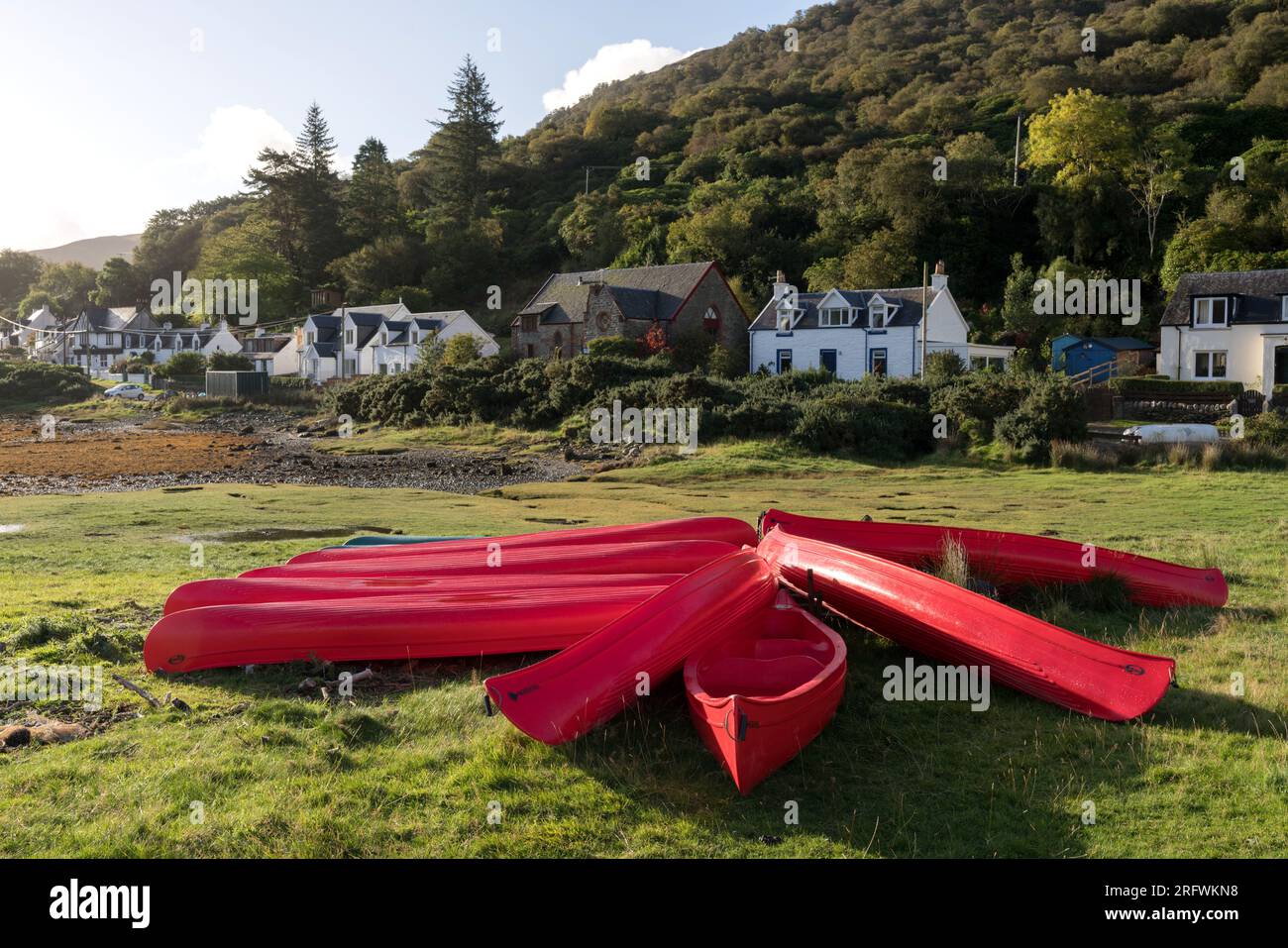 Red canoes at Lochranza, Isle of Arran, Scotland Stock Photo