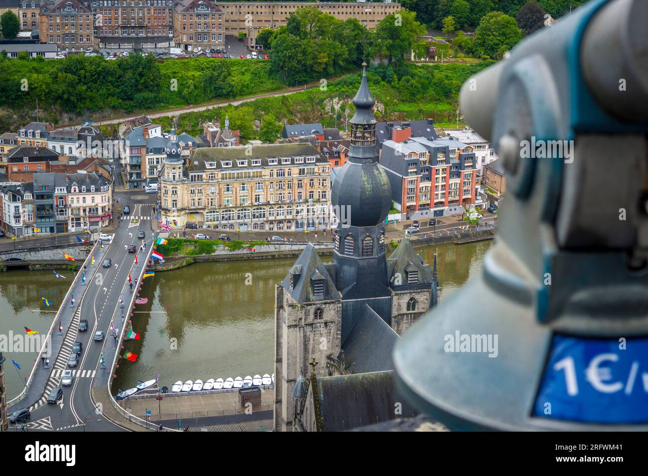 Dinant, Belgium, 03 August 2023: High angle viewpoint on the city of Dinant in the Ardennes of Wallonia, Belgium. River Meuse flowing below, view on C Stock Photo