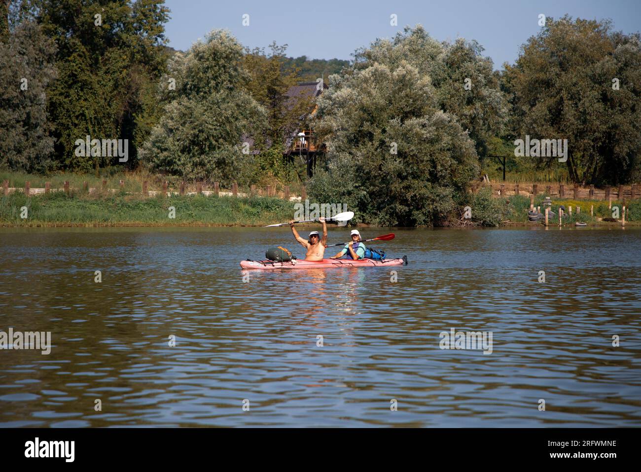 Serbia, Aug 04, 2023: The participants of the TOUR INTERNATIONAL DANUBIEN (TID) regatta (source of the Danube-Black Sea) passing a stage Veliko Selo Stock Photo