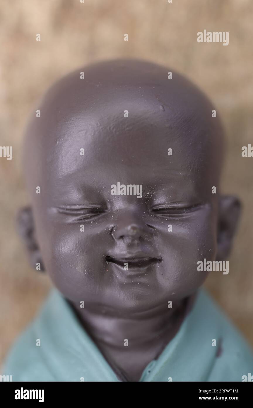 Model of head and shoulders of young Buddha or Buddhist monk with ...