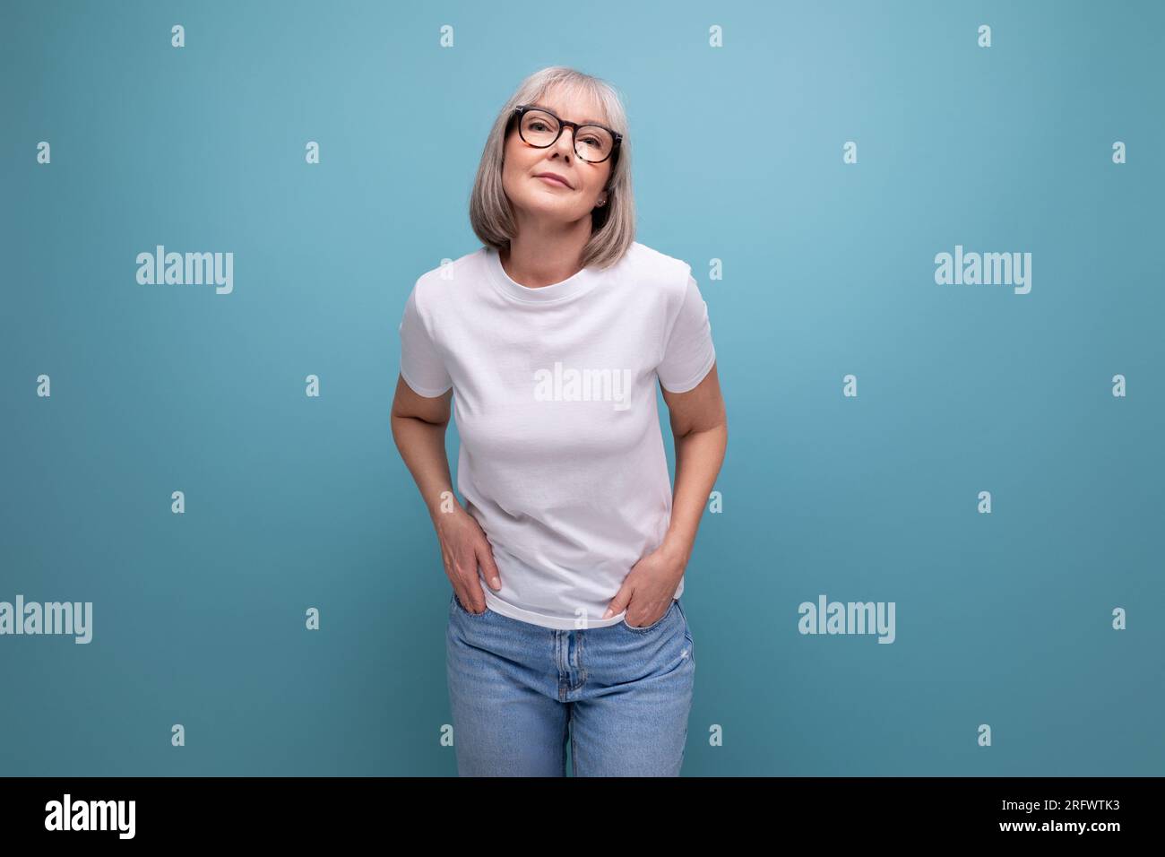 mature woman in gray hair being premenopausal in studio background