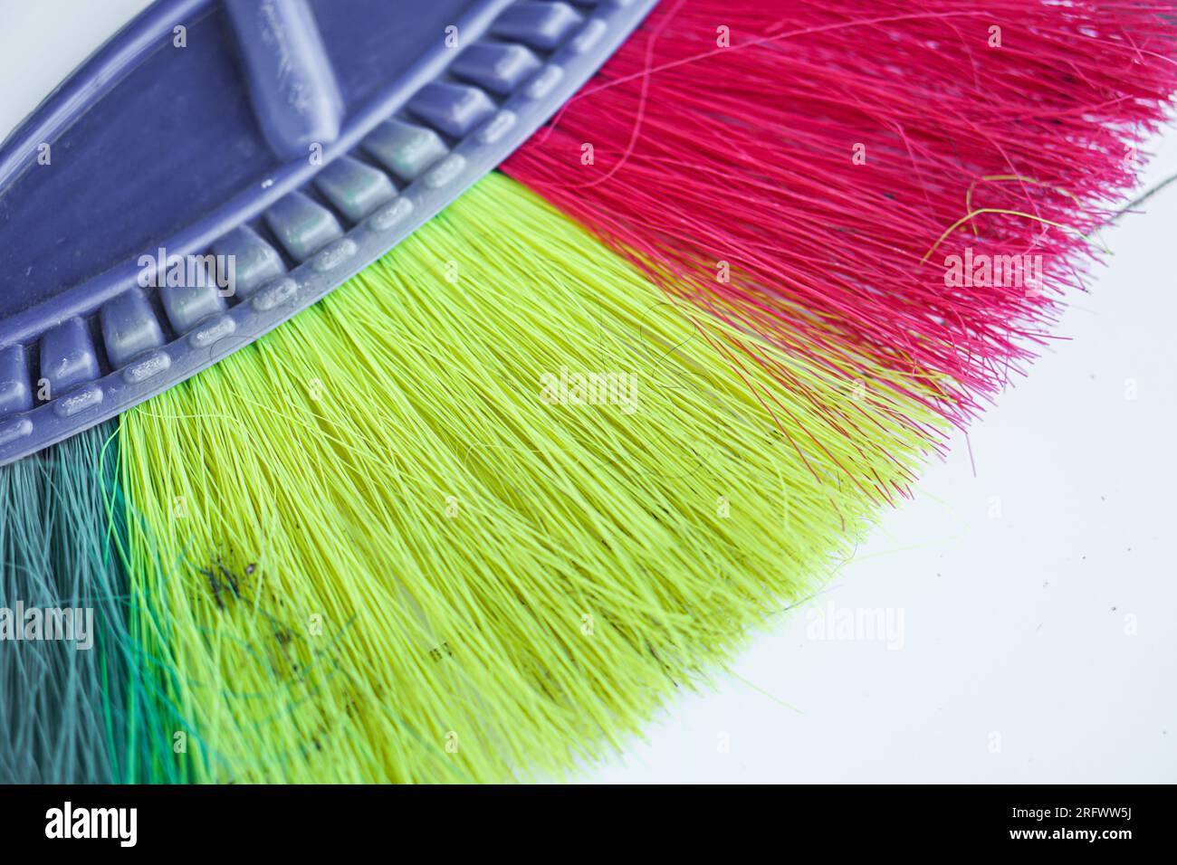 Colorful plastic broom close up picture Stock Photo