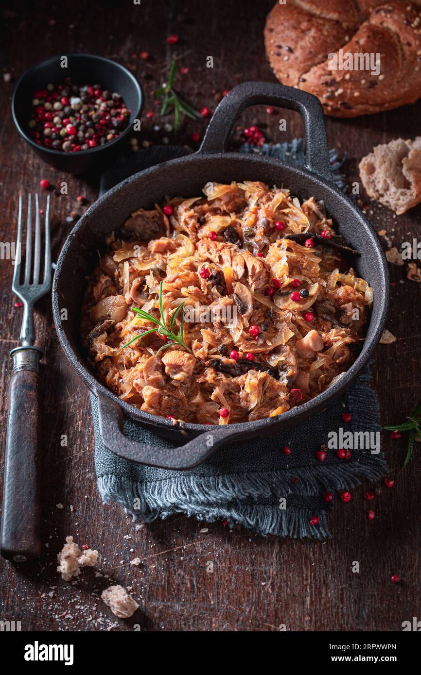 Hot and spicy stew made of beef and sauerkraut. Bigos is traditional Polish food. Stock Photo