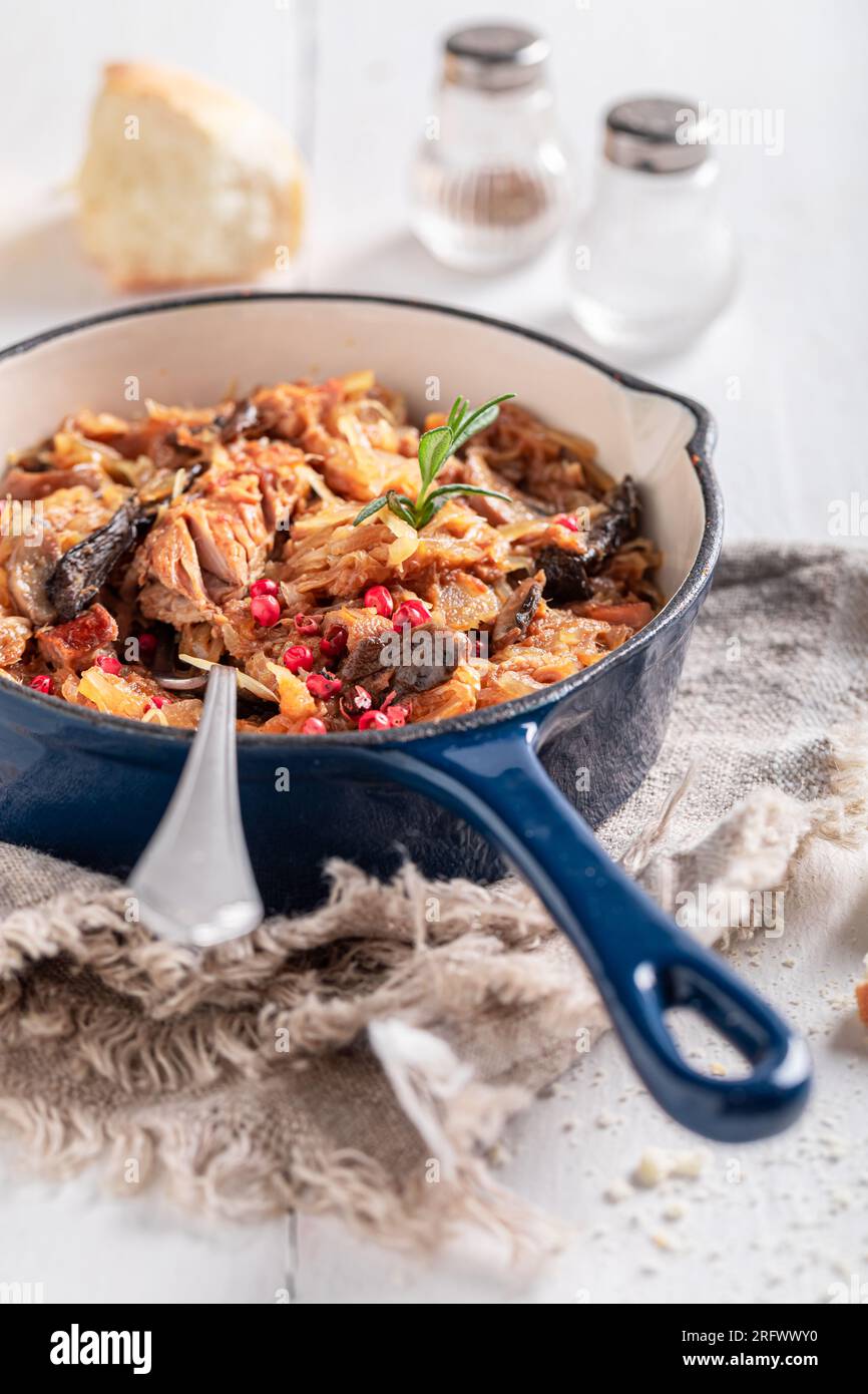 Hot and spicy stew made of cabbage and beef. Bigos is traditional Polish food. Stock Photo