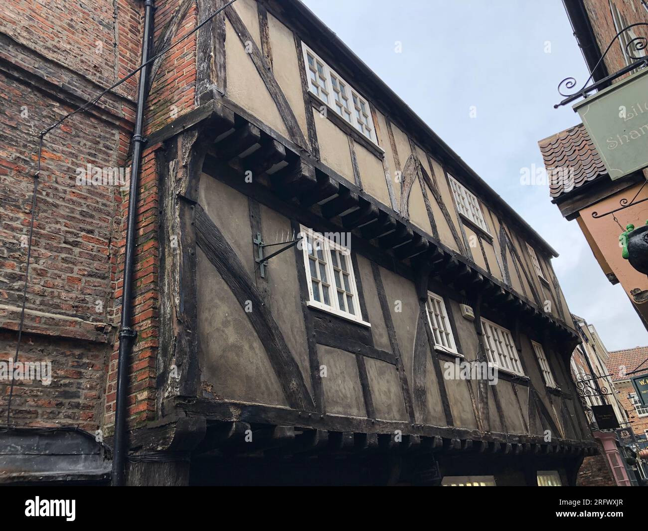 The Shambles York, is a narrow street of  half-timbered and old medieval building dating back as far as the 14th century Stock Photo