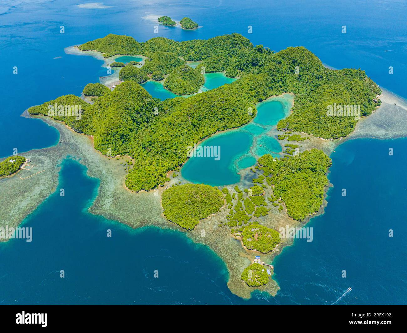 Aerial survey of lagoons in Tinago Island. Beautiful beach with turquoise water. Surigao del Norte, Mindanao, Philippines. Stock Photo