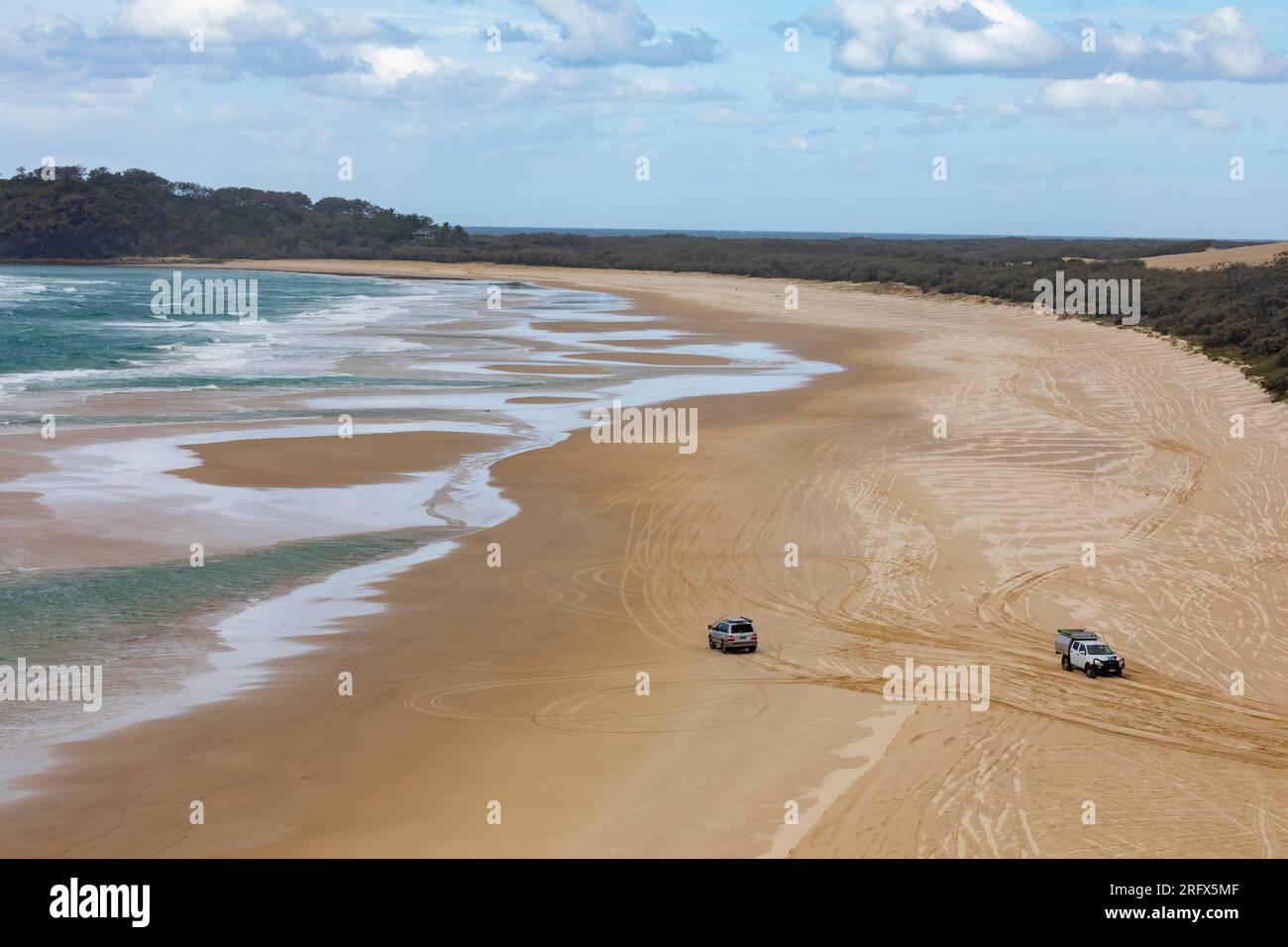 Beach sand driving on Fraser Island k'agri , 4x4 vehicles drive on 75 mile beach's legal highway road,Queensland,Australia near Indian head Stock Photo
