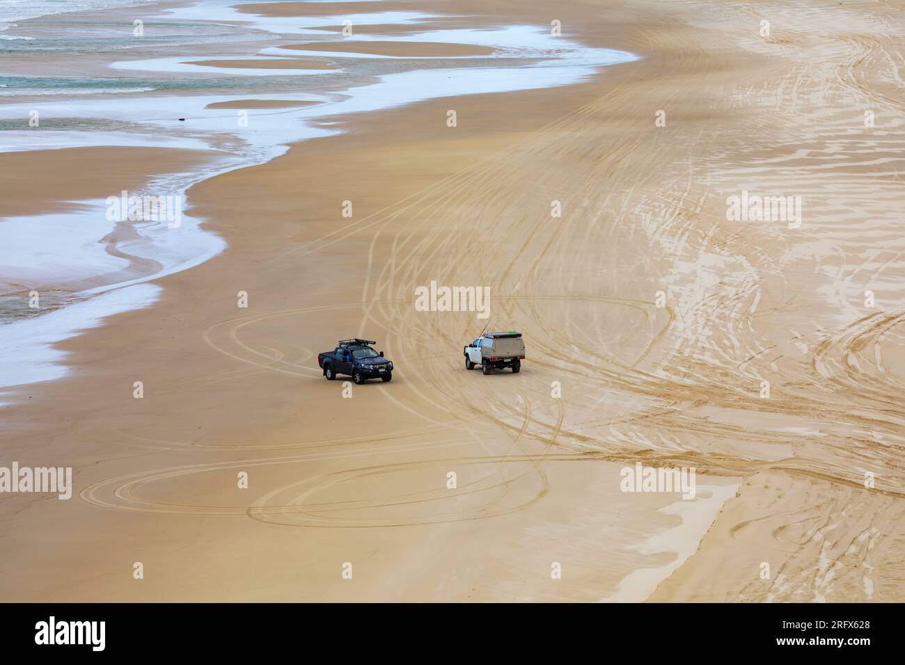 Beach sand driving on Fraser Island k'agri , 4x4 vehicles drive on 75 mile beach's legal highway road,Queensland,Australia Stock Photo