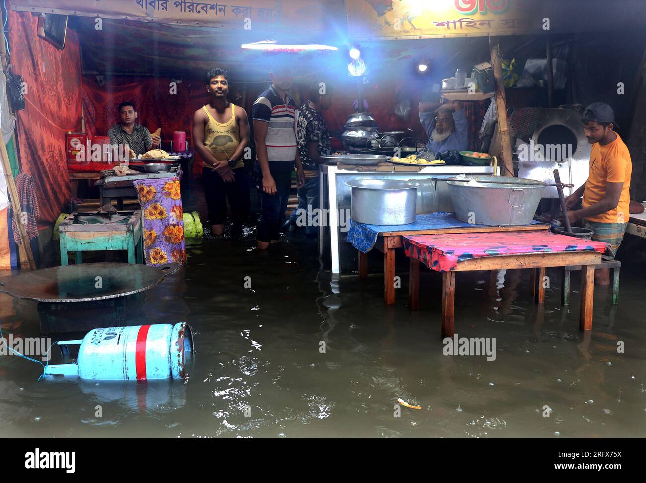 Chittagong, Agrabad, Bangladesh. 6th Aug, 2023. August 6, 2023. Chittagong, Bangladesh : Chattogram Maa-O-Shishu Hospital College area drowned due to high tide and three days of heavy rain in Chittagong, Bangladesh.Most of the areas of the city have become submerged due to rain. The road is submerged in knee-to-waist water. Furniture is getting damaged due to water entering shops and houses. Chittagong city people are suffering. (Credit Image: © Mohammed Shajahan/ZUMA Press Wire) EDITORIAL USAGE ONLY! Not for Commercial USAGE! Credit: ZUMA Press, Inc./Alamy Live News Stock Photo