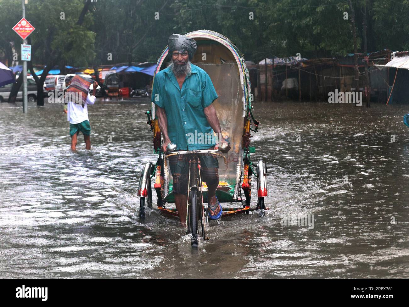 Chittagong, Agrabad, Bangladesh. 6th Aug, 2023. August 6, 2023. Chittagong, Bangladesh : Chattogram Maa-O-Shishu Hospital College area drowned due to high tide and three days of heavy rain in Chittagong, Bangladesh.Most of the areas of the city have become submerged due to rain. The road is submerged in knee-to-waist water. Furniture is getting damaged due to water entering shops and houses. Chittagong city people are suffering. (Credit Image: © Mohammed Shajahan/ZUMA Press Wire) EDITORIAL USAGE ONLY! Not for Commercial USAGE! Credit: ZUMA Press, Inc./Alamy Live News Stock Photo