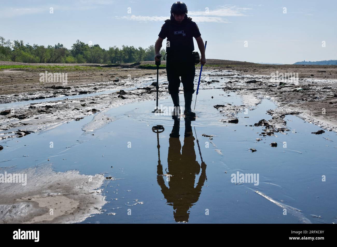 A Ukrainian sapper inspects the shoreline during the demining of a Dnipro river in Zaporizhzhia. Ukraine’s international partners will give it over US$244 million for humanitarian mine clearance. Source: Yuliia Svyrydenko, First Deputy Prime Minister and Minister of Economic Development and Trade of Ukraine. Ukraine will also receive individual mine clearance kits, explosive protective suits, quadcopters, and robotic systems for the disposal of ammunition. Stock Photo