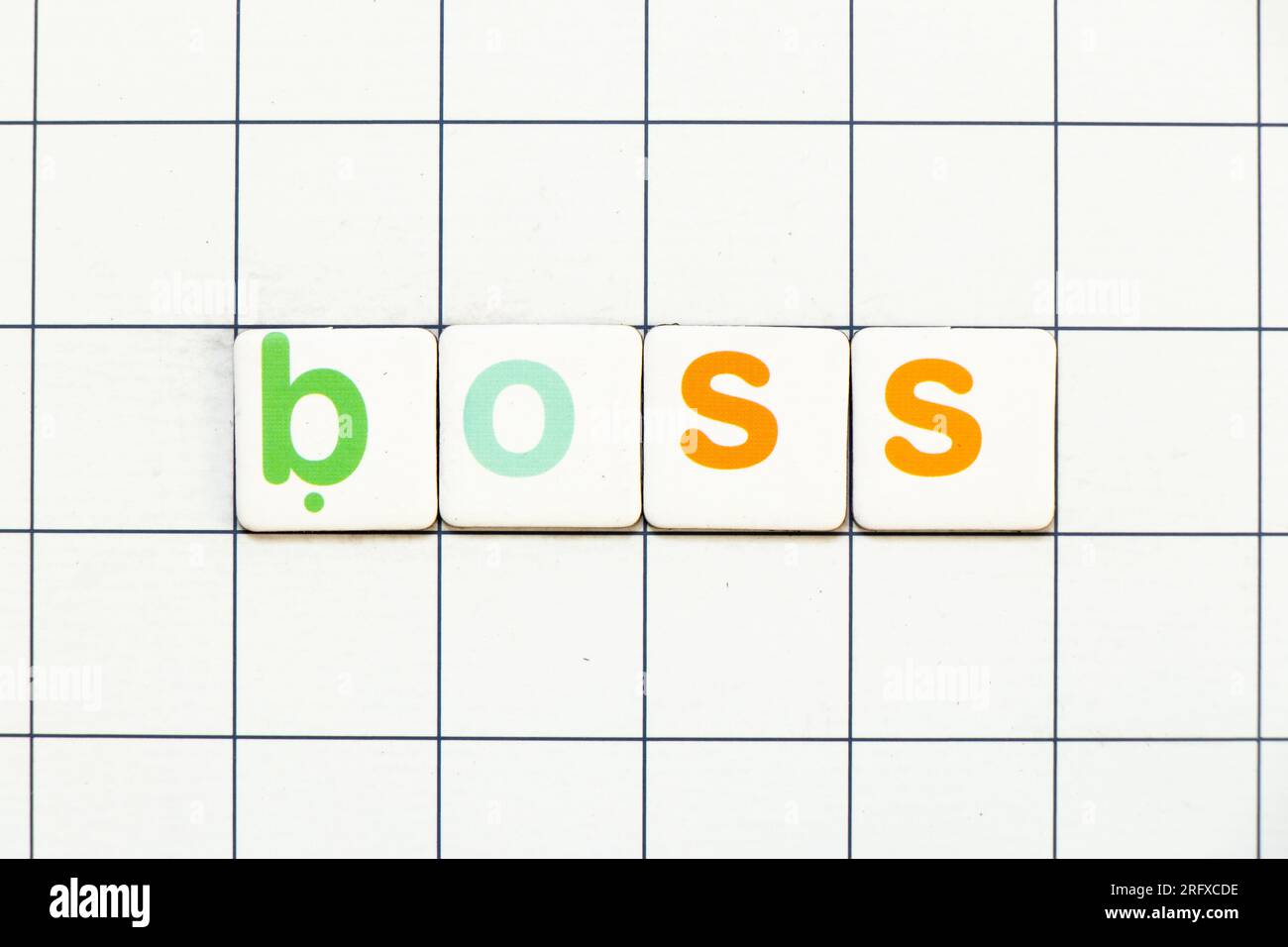 Colorful tile letter in word boss on white grid background Stock Photo