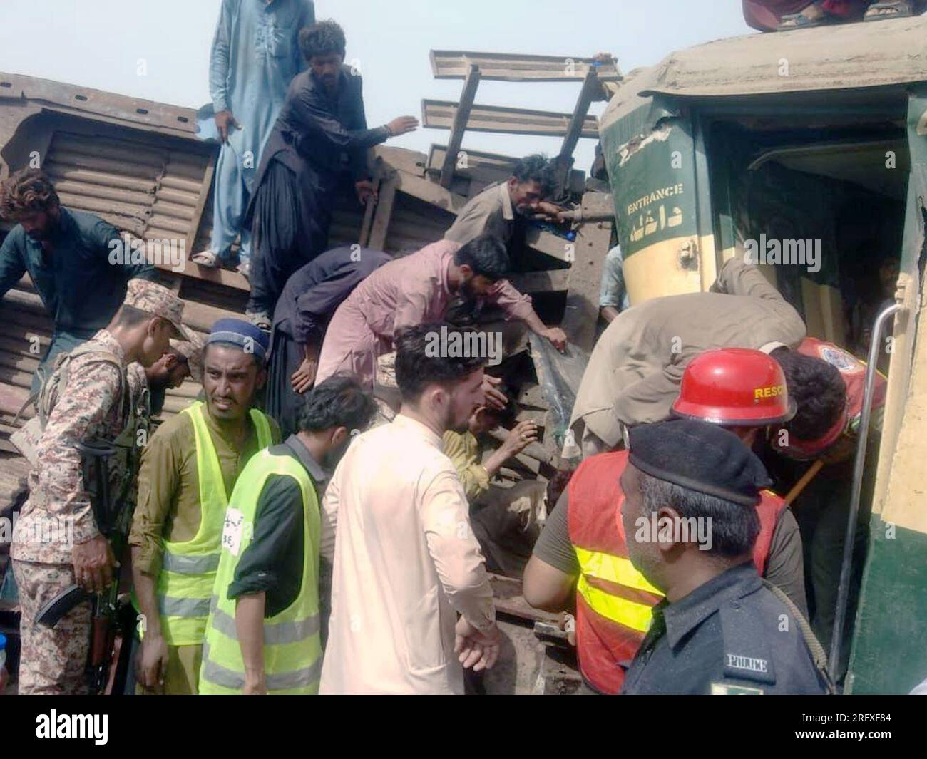 Islamabad. 6th Aug, 2023. This photo taken with a mobile phone shows people carrying out rescue work at the train accident site in the Sanghar district of Pakistan's southern Sindh province on Aug. 6, 2023. At least 22 people were killed and over 50 others injured on Sunday after a passenger train derailed in the Sanghar district of Pakistan's southern Sindh province, local police said. Credit: Str/Xinhua/Alamy Live News Stock Photo