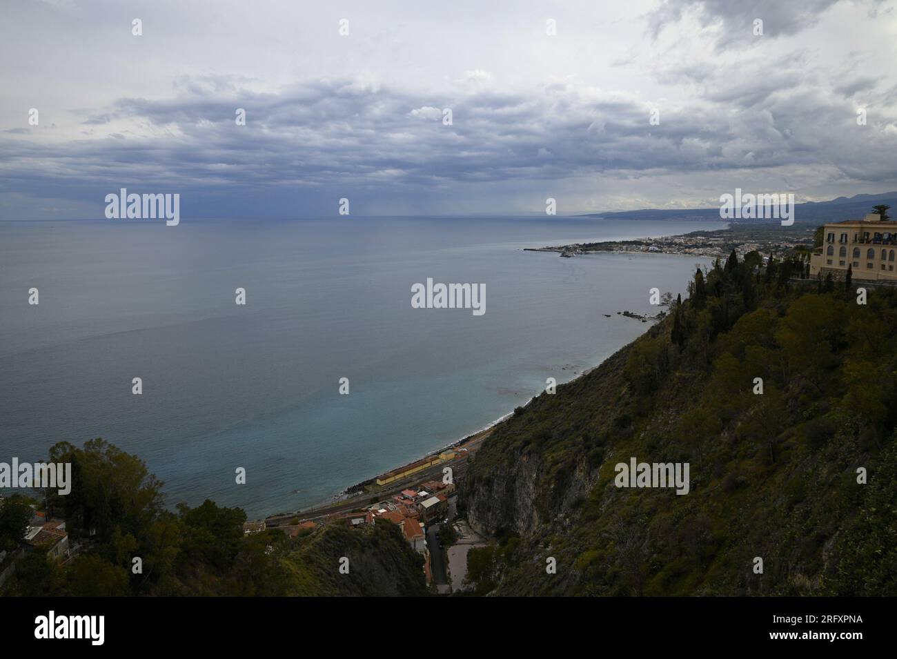 Scenic view of Giardini Naxos as seen from Parco Trevelyan a public garden and local attraction known as Villa Comunale in Taormina Sicily, Italy. Stock Photo