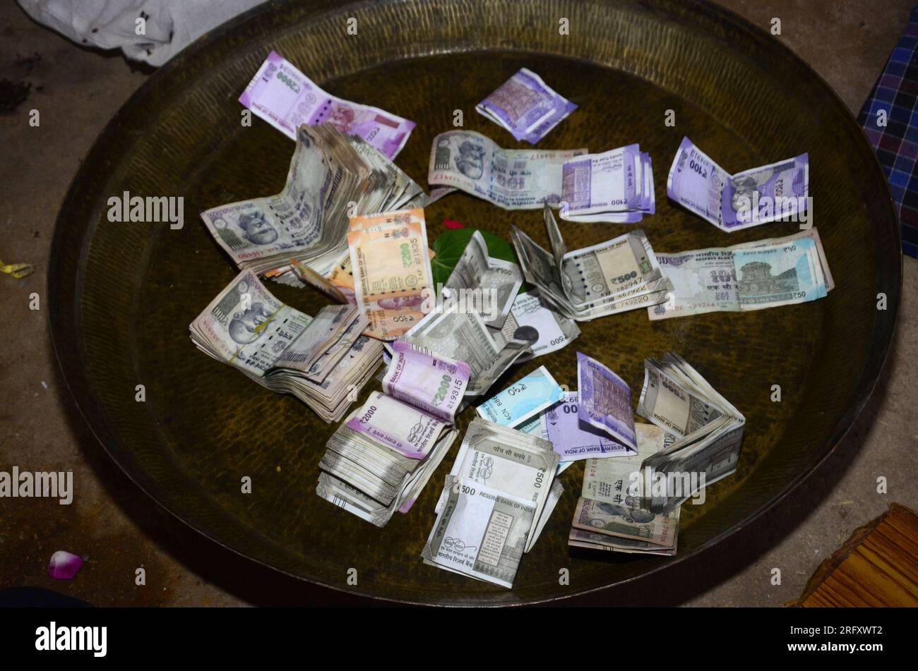 Indian currency in brass plate. New Indian currency 2000-500-200-50 and others Stock Photo