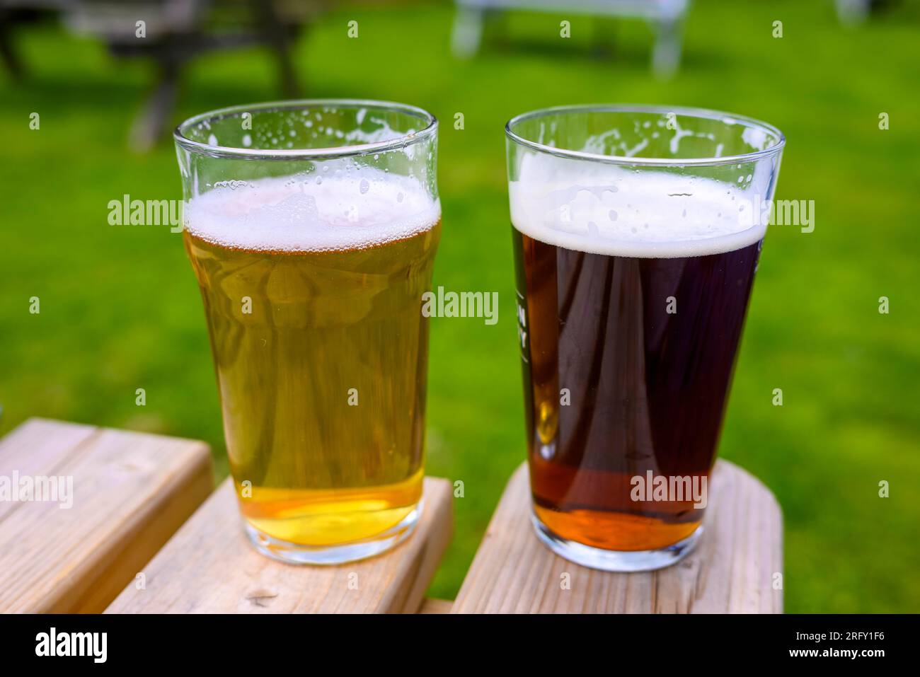 Two pints of beer on a table in a pub garden Stock Photo