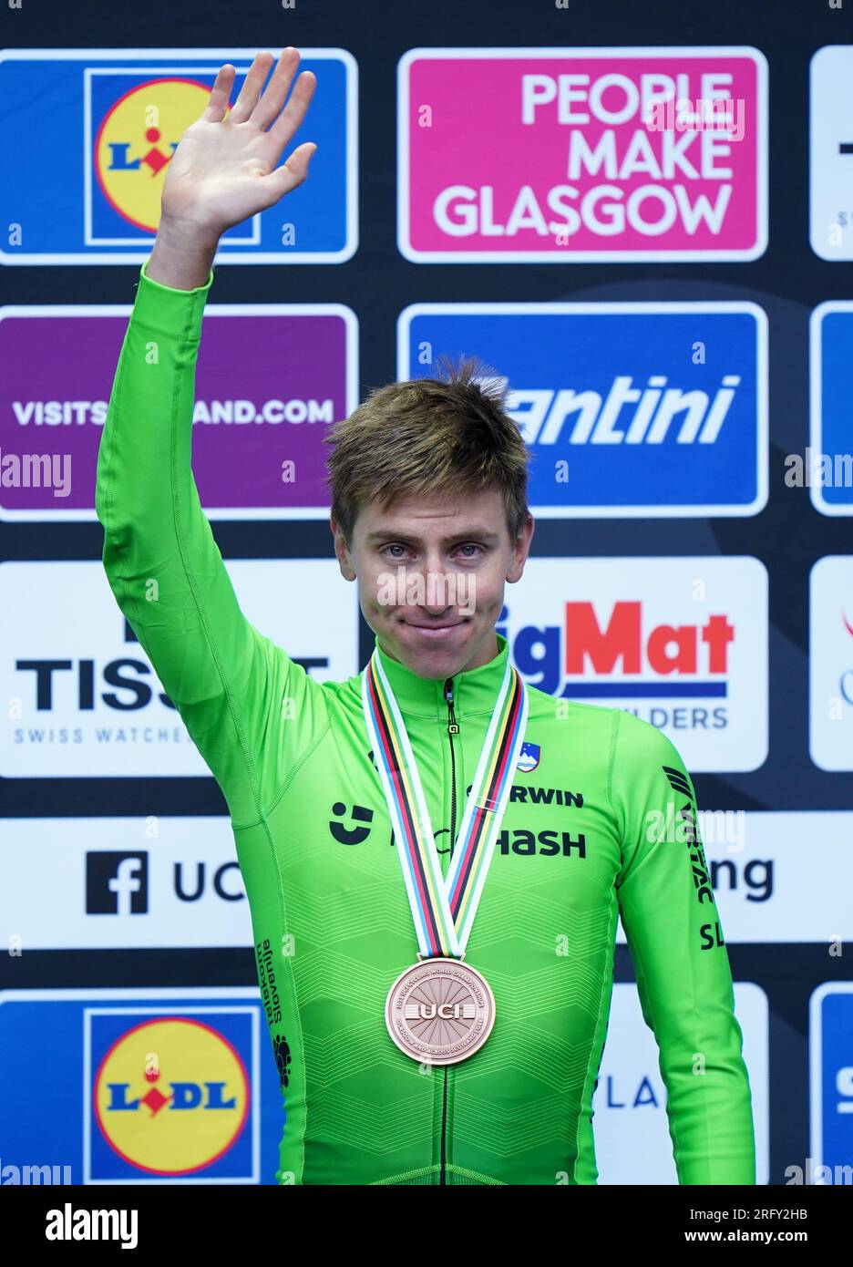 Slovenia's Tadej Pogacar with his bronze medal on the podium after the