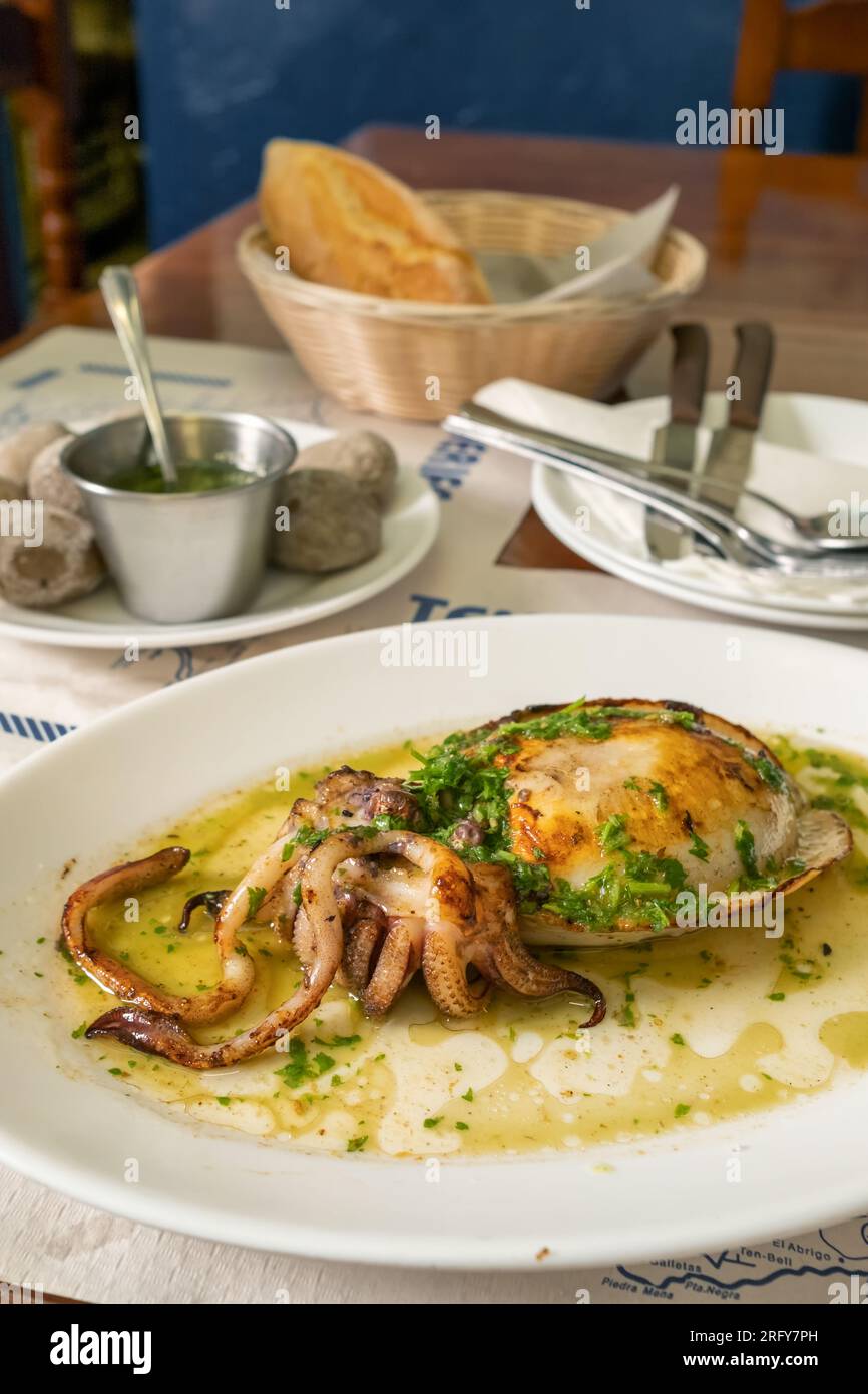 Grilled cuttlefish or choco dish in the traditional Canarian restaurant on Tenerife island, Spain. Stock Photo