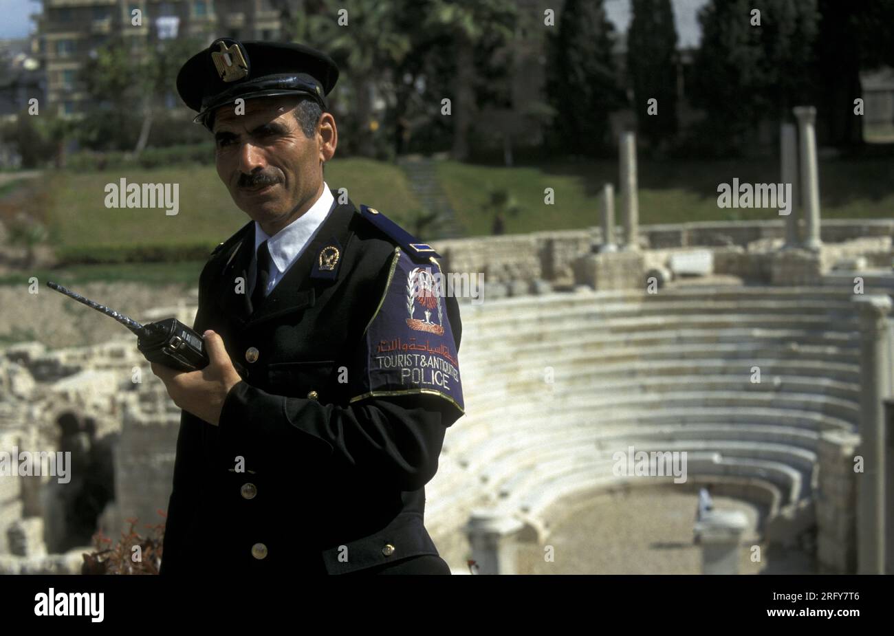 a tourist police men at the archaeological site at the Roman Amphitheater Kom El Bekka in the City Centre of Alexandria on the Mediterranean Sea in Eg Stock Photo