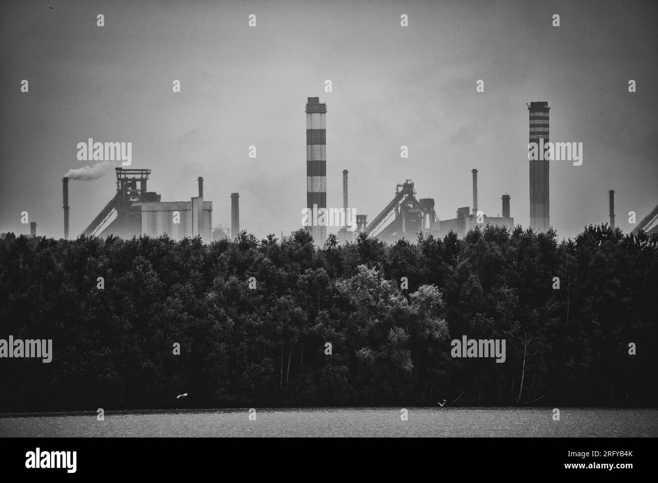 Industrial steel factory, iron works. Metallurgical plant. steelworks. Heavy industry in Europe. Air pollution from chimneys. Ironworks on a backgroun Stock Photo