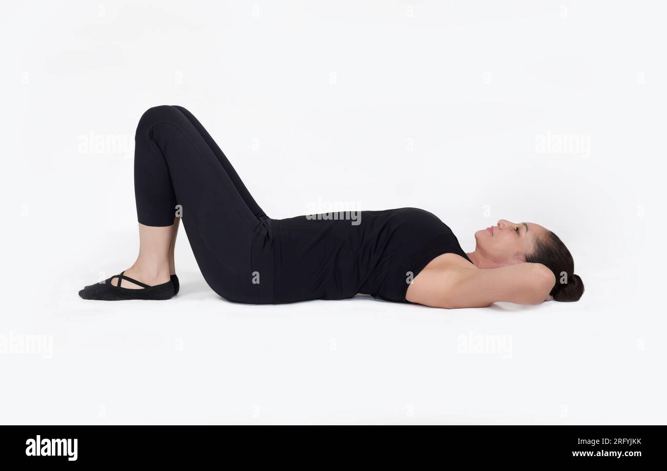 Specialized trauma releasing exercises for elderly people, 55 years old woman trainer posing for