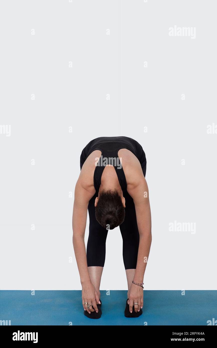Specialized trauma releasing exercises for elderly people, 55 years old woman trainer posing for