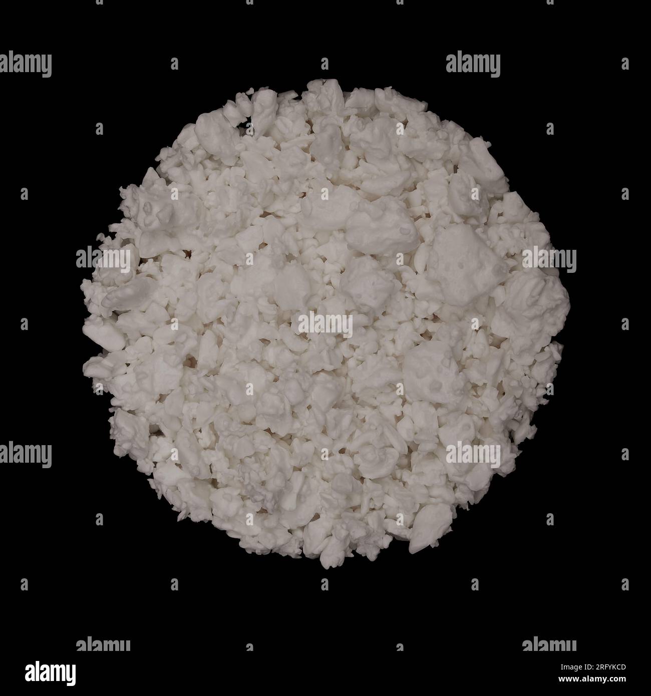 Cottage cheese round texture background isolated on black background