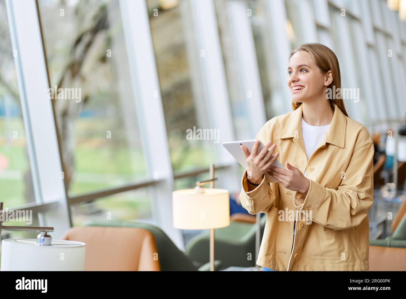 Happy girl student using digital tablet modern tech device. Copy space Stock Photo