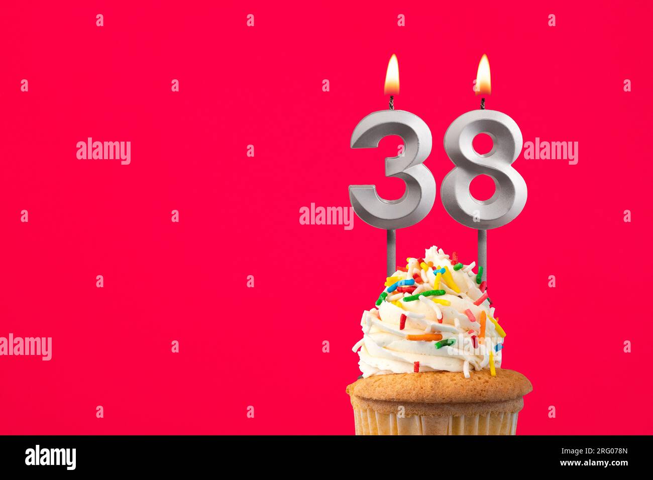 Burning candle number 38 - Birthday card with cake Stock Photo - Alamy