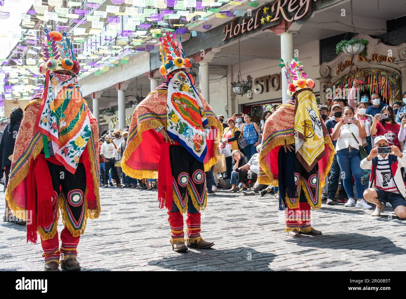 Mexican costumed dancers perform the La Danza de los Moros or Dance of the Moors at the start of the Palm Sunday Handcraft Market or Tianguis de Domingo de Ramos April 9, 2022 in Uruapan, Michoacan, Mexico. The week long handicraft market is considered the largest in the Americas. Stock Photo