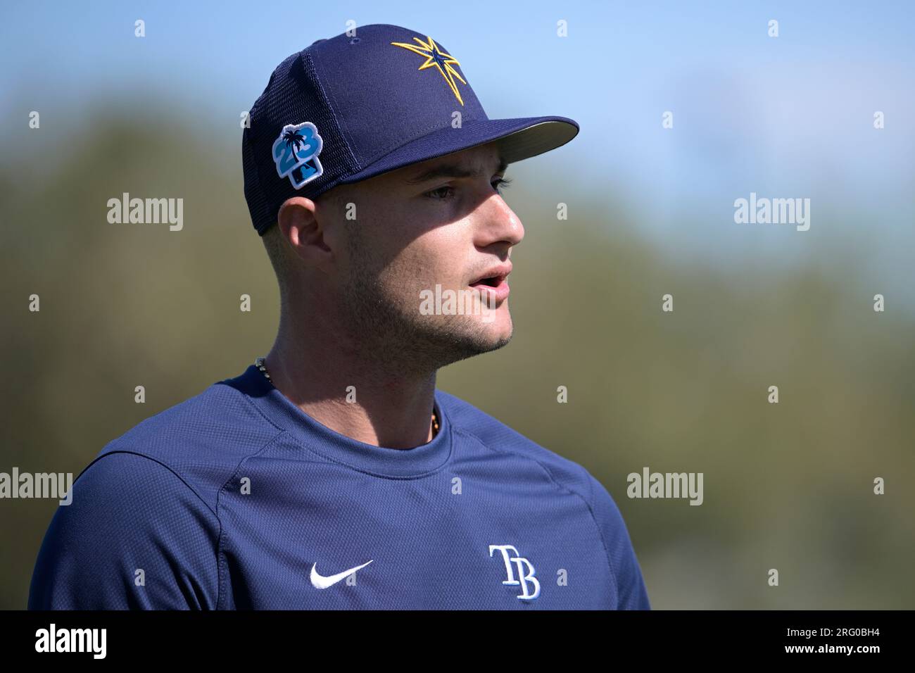 Tampa Bay Rays pitchers Josh Fleming, left to right, Zach Eflin and Shane  McClanahan laugh in the dugout after watching infielder Luke Raley pitch  during a baseball game against the Toronto Blue