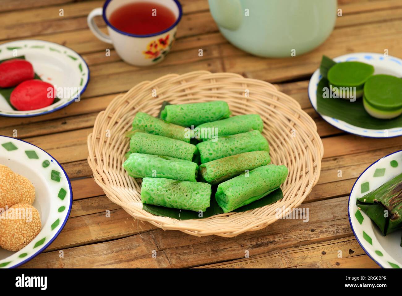 Dadar Gulung, Thin Pancake with Pandan Juice, Rolled with Sweet Grated Coconut Inside. Known as Kuih Ketayap Stock Photo
