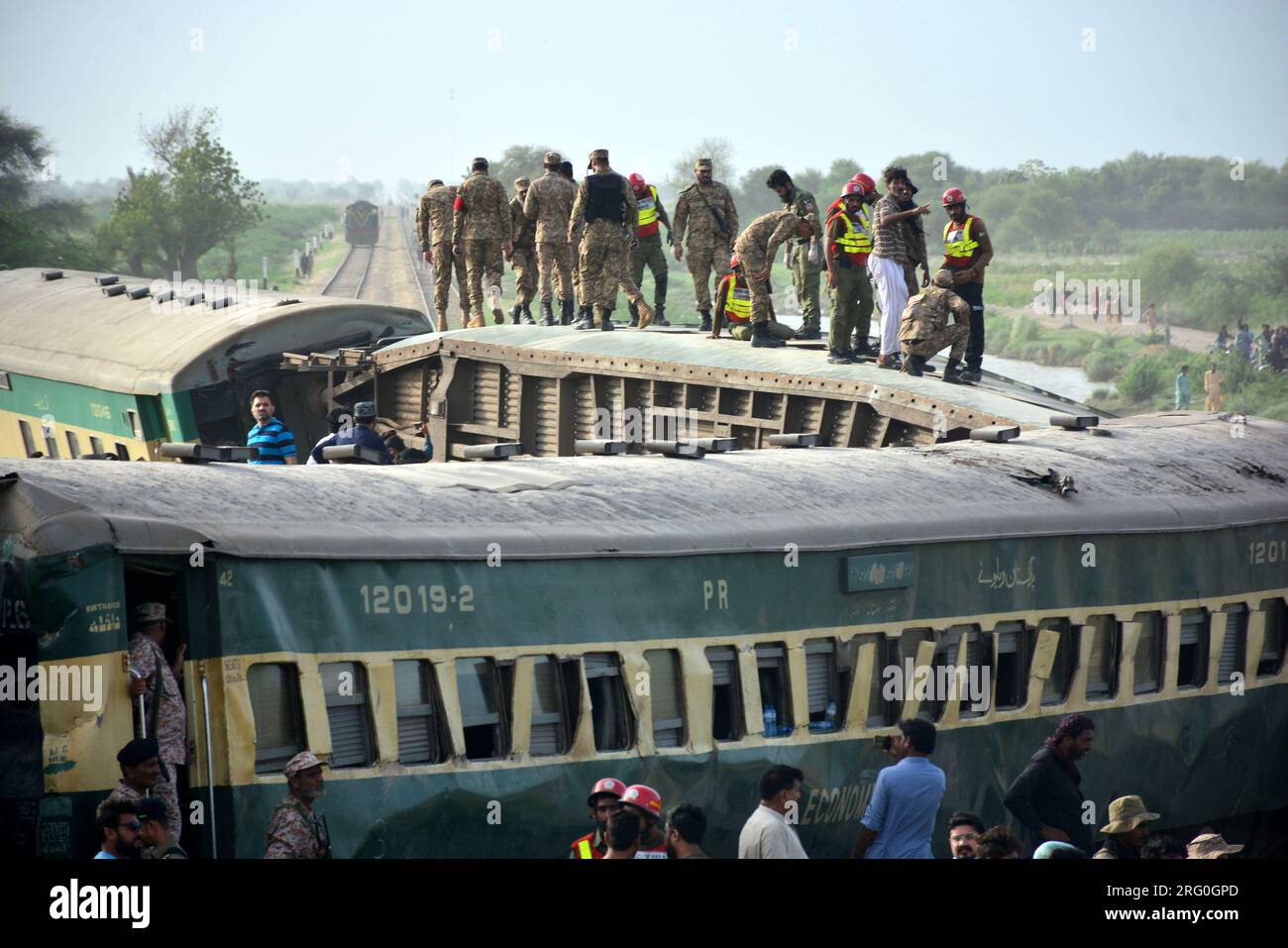 (230807) -- SANGHAR, Aug. 7, 2023 (Xinhua) -- Paramilitary personnel search for victims on derailed coaches of a passenger train in Sanghar district of Pakistan's southern Sindh province, on Aug. 6, 2023. At least 22 people were killed and over 50 others injured on Sunday after a passenger train derailed in the Sanghar district of Pakistan's southern Sindh province, local police said.The accident took place when 10 coaches of the Hazara Express train derailed when it was crossing a canal bridge near Sarhari town in the Shahdadpur area of the district, Muhammad Younis Chandio, deputy inspector Stock Photo