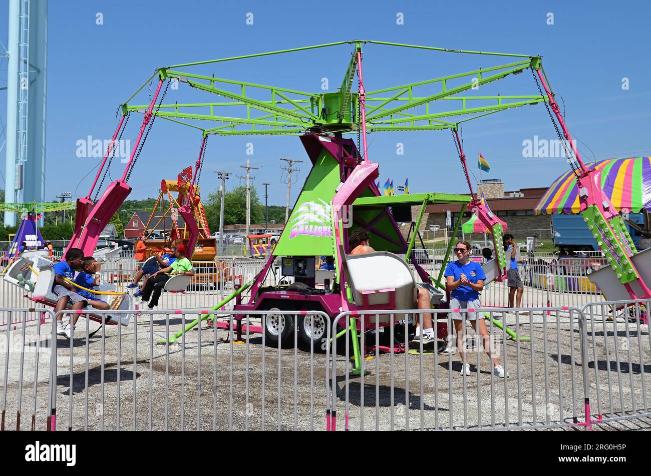 Wheaton, Illinois, USA. Despite very high temperatures, carnival or amusement rides are always popular with kids as was the case at the DuPage County Stock Photo