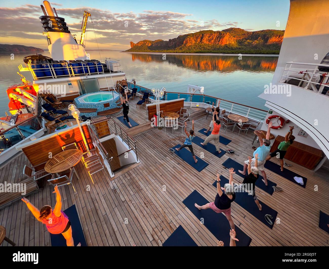 Morning yoga on the National Geographic Orion on the Hunter River in Kimberley Australia Stock Photo