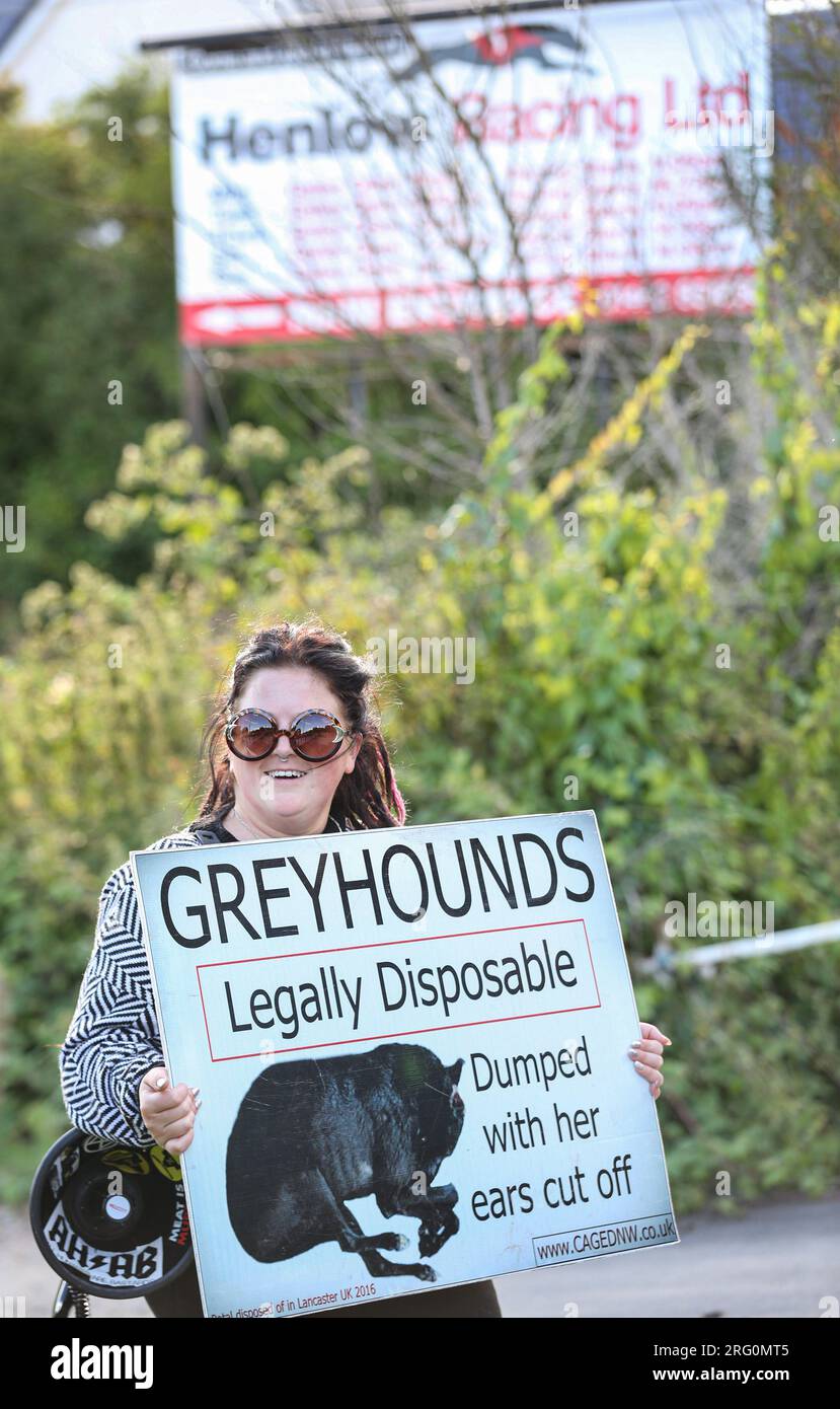 Henlow, UK. 06th Aug, 2023. A protester holds a placard saying 'Greyhounds Legally Disposable' outside the dog stadium during the demonstration. Animal Rights activists protest outside Henlow dog racing track. They are aiming to highlight the cruelty associated with dog racing. In 2021 there were 4422 injuries and 120 deaths on registered greyhound race tracks in the UK. Credit: SOPA Images Limited/Alamy Live News Stock Photo