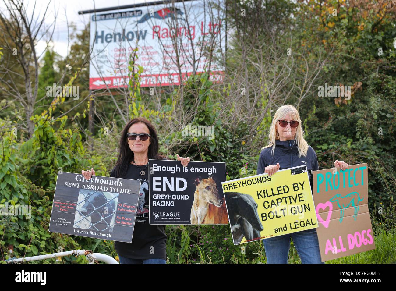Henlow, UK. 06th Aug, 2023. Protesters hold up placards highlighting the plight of racing dogs outside the dog stadium during the demonstration. Animal Rights activists protest outside Henlow dog racing track. They are aiming to highlight the cruelty associated with dog racing. In 2021 there were 4422 injuries and 120 deaths on registered greyhound race tracks in the UK. Credit: SOPA Images Limited/Alamy Live News Stock Photo